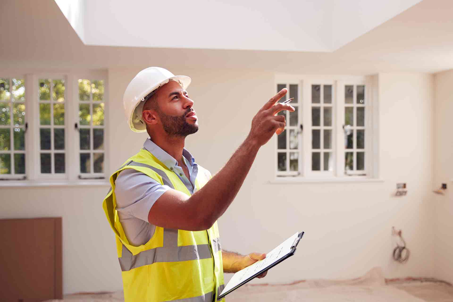 Third Party Wall Surveyors Coventry reviewing plans between two parties during a dispute